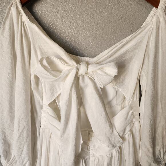 Saints + Secrets Puff Sleeve Open Back Bow White Ruffle Dress - Picture 6 of 9